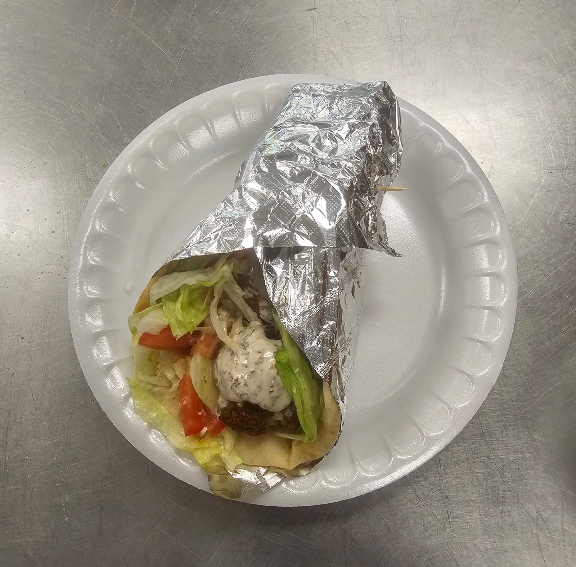 Gyro wrap with lettuce, tomato, and tzatziki